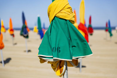 Closed beach umbrellas at beach