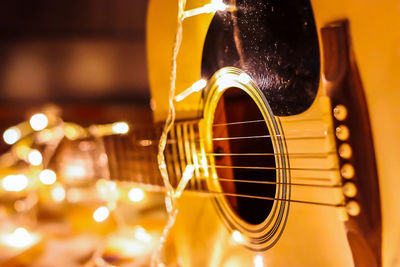 Close-up of illuminated lights on guitar