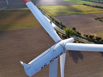 High angle view of airplane flying over landscape