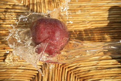 Close-up of wet fruit on wood