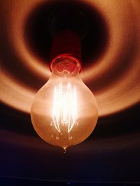 Low angle view of illuminated light bulb