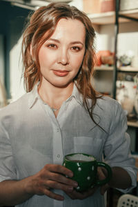 Relaxed woman with a mug of tea in the sunlight