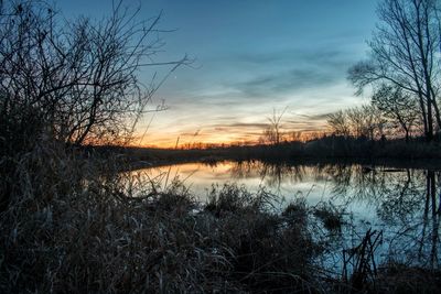 Scenic view of lake during sunset