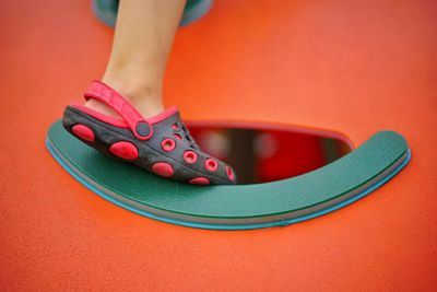 Low section of child playing in playground