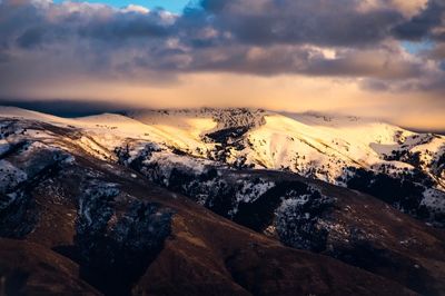 Scenic view of mountains against sky during sunset