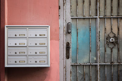 Closed door of old building letter boxes 