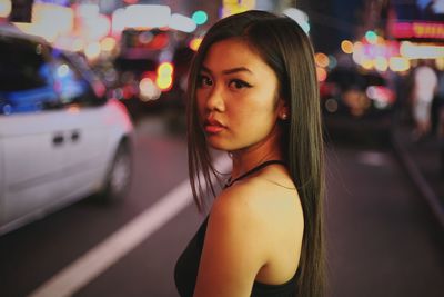 Portrait of young woman in car