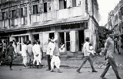 People walking on street in city