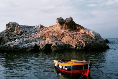 Boat on shore against sky