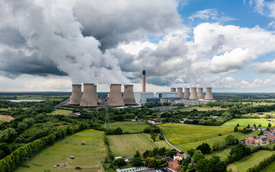 Aerial landscape view of coal fired power station with smoking chimney emissions co2 pollution