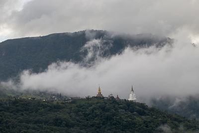 Phra that pha son kaew temple in the mist at khao kho, phetchabun, thailand