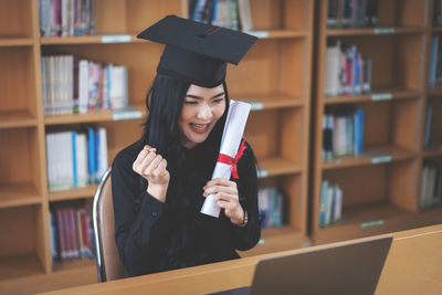 Young woman reading book