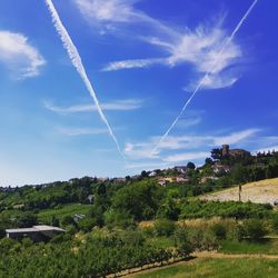 Scenic view of vapor trails in sky