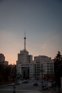 Buildings in city against clear sky