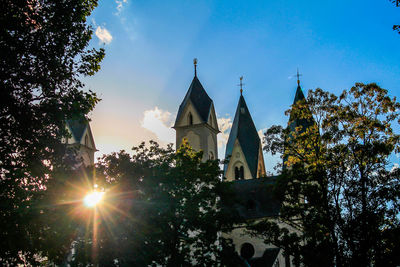 Low angle view of bell tower against sky