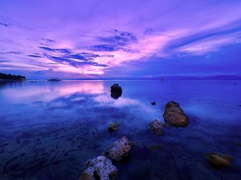 Scenic view of sea against sky at sunset