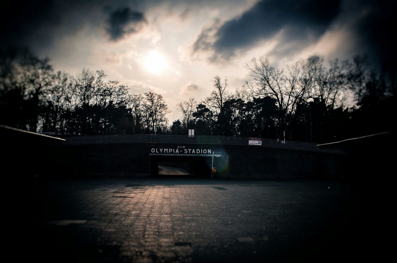 tree, sky, silhouette, cloud - sky, bare tree, transportation, cloudy, road, the way forward, sunset, cloud, dusk, tranquility, nature, railing, outdoors, connection, no people, street, built structure