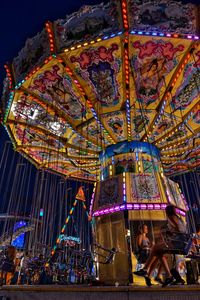 Illuminated ferris wheel at night