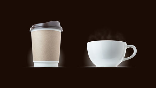 Close-up of coffee cup against black background