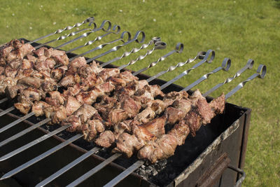 Close-up of meat on barbecue grill