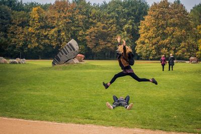 People playing on grassy field