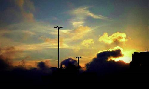 Low angle view of cloudy sky at sunset