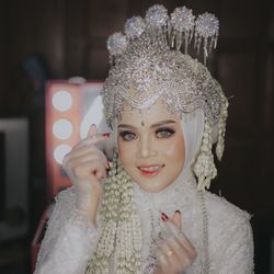 Portrait of bride wearing make up