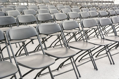Full frame shot of empty chairs arranged in room