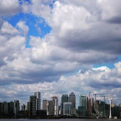 Modern buildings in city against sky