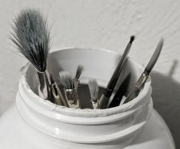 High angle view of paintbrushes in container