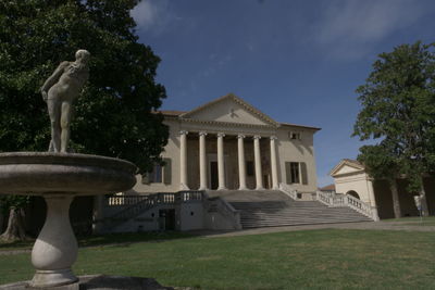 Statue in front of historical building