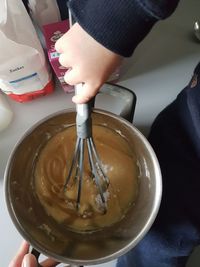 High angle view of woman preparing food in bowl