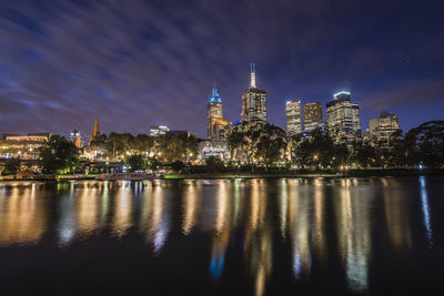 Illuminated buildings in city at night