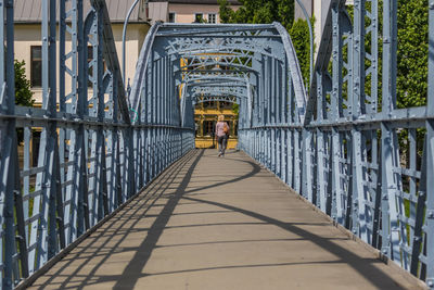 People walking on footbridge