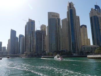 Modern buildings in city against sky