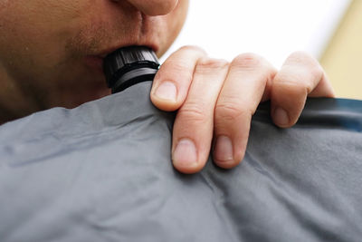 Close-up of man holding camera