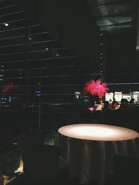 Close-up of illuminated flower on table
