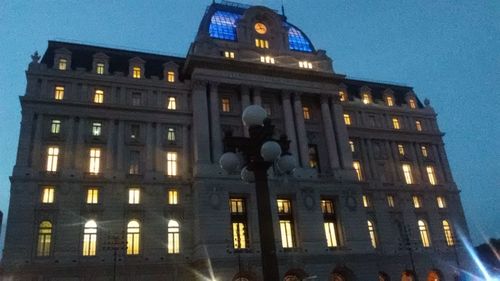 Low angle view of modern building at night