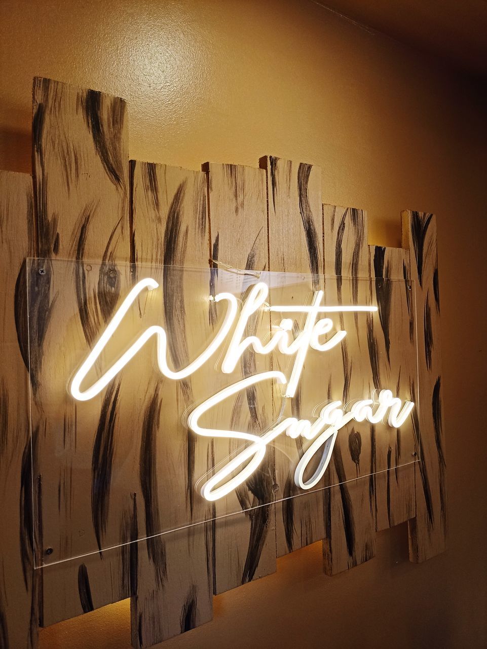 illuminated, light, text, art, no people, communication, indoors, handwriting, western script, lighting equipment, lighting, wall - building feature, night, glowing