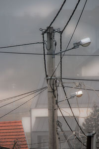 Low angle view of cables against sky