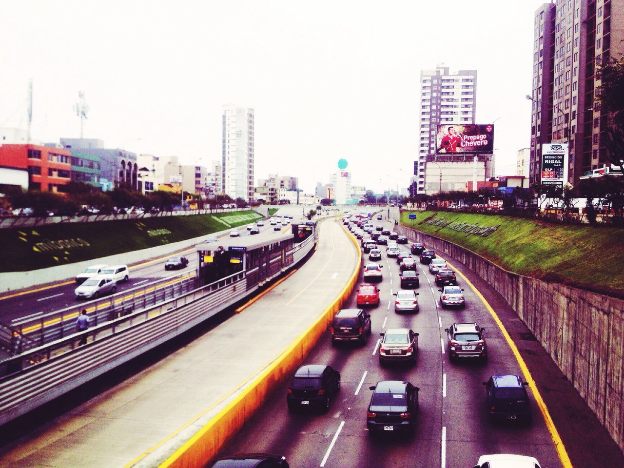 transportation, city, architecture, high angle view, built structure, car, building exterior, traffic, land vehicle, mode of transport, illuminated, city life, road, no people, sky, outdoors, day