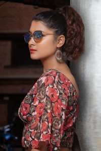 Portrait of young woman standing outdoors