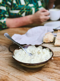 Close-up of person preparing food on cutting board