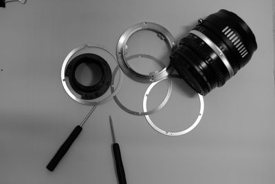 High angle view of camera lens on gray background