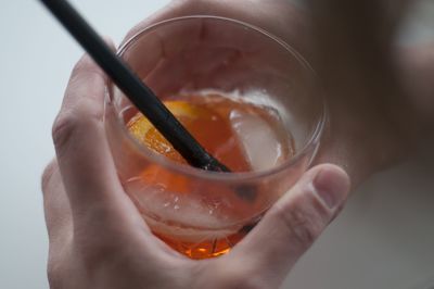 Close-up of hand holding drink