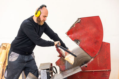 Side view of man working at construction site