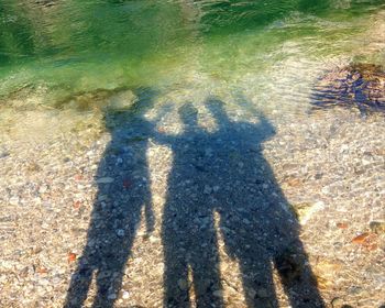 Shadow of people on beach