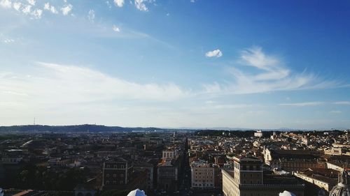 Aerial view of cityscape against sky