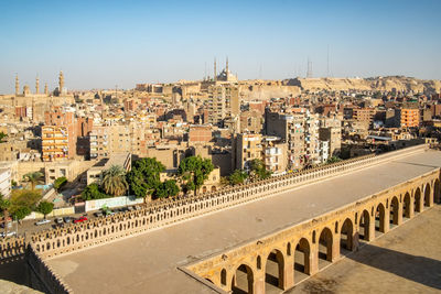 High angle view of buildings against clear sky