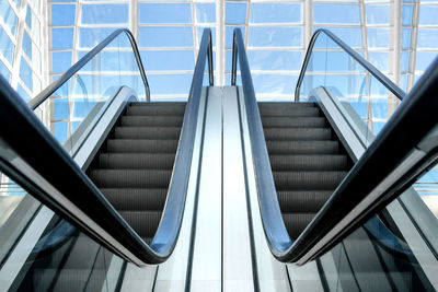 Low angle view of escalators in building